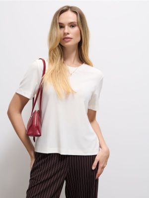 Bluzka damska casual Mohito ze sklepu: Mohito w kategorii: Bluzki damskie - zdjęcie 55A556F-010-6967_010HJ