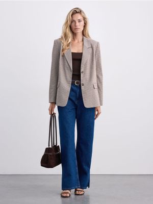 Jeansy damskie w miejskim stylu Mohito ze sklepu: Mohito w kategorii: Jeansy damskie - zdjęcie 55A556F-010-6967_090KG