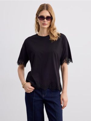 Bluzka damska casual Mohito ze sklepu: Mohito w kategorii: Bluzki damskie - zdjęcie 55A556F-010-6967_745LT